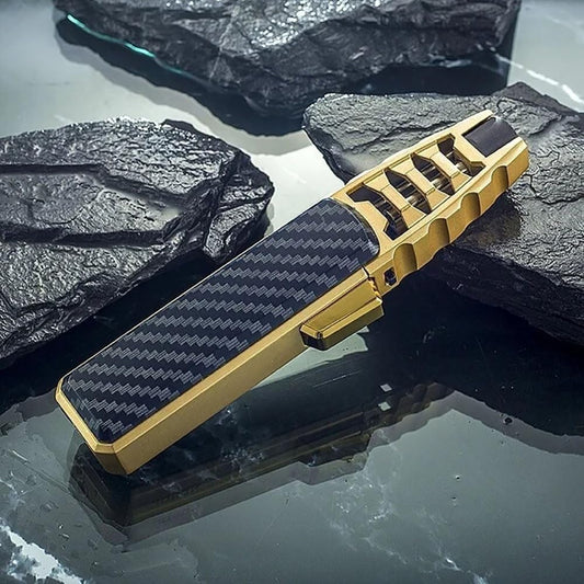 Windproof Jet Torch Lighter by FilamentHub Hardware in Black Carbon Fiber Style with gold accents, shown on a textured surface