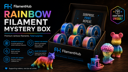 Rainbow filament mystery box with colorful items on a dark surface, featuring FilamentHub branding.
