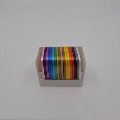 3D printed filament colour sample swatches in organised holders, showcasing a wide range of PLA Silk colours for 3D printing material selection