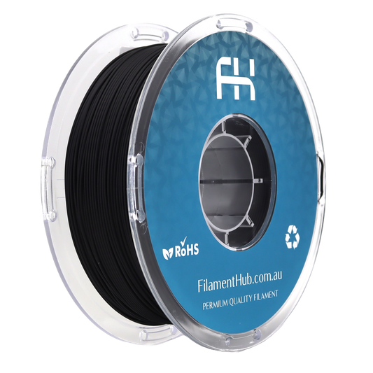 Spool of black filament with blue label on a white background