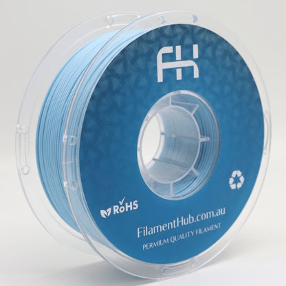 Matte pastel blue PLA 1.75mm 3D printer filament spool by FilamentHub with a smooth matte finish, ideal for detailed prints, decorative models, prototypes, and everyday 3D printing projects.