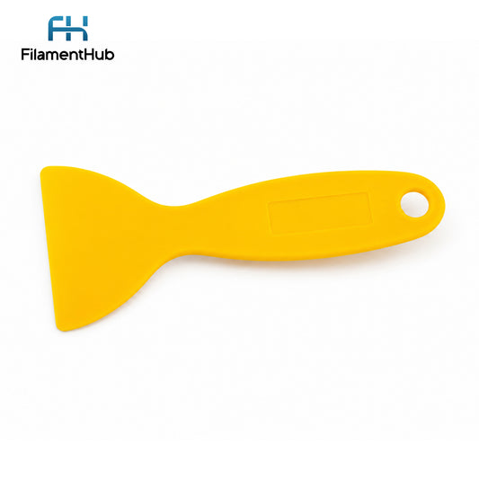 Yellow spatula with a white handle on a white background, branded with FilamentHub.